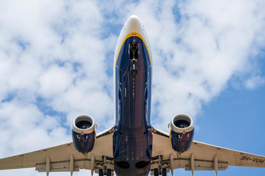 commercial airplane in flight over manises