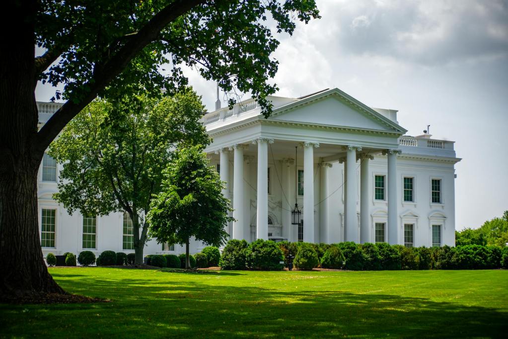 white house exterior in lush greenery